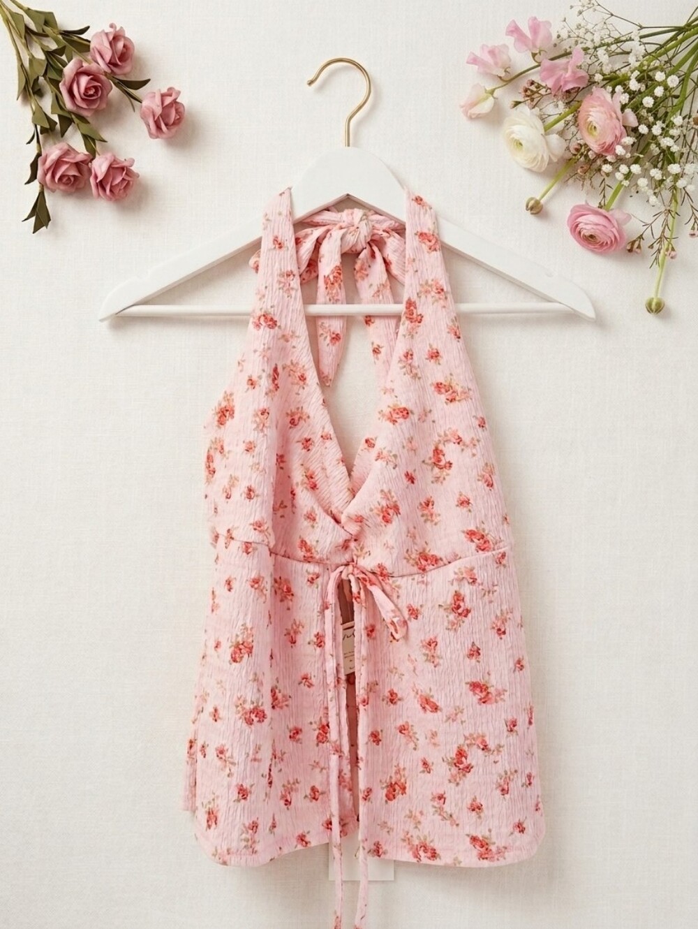 Pink floral halter top with ruffle details